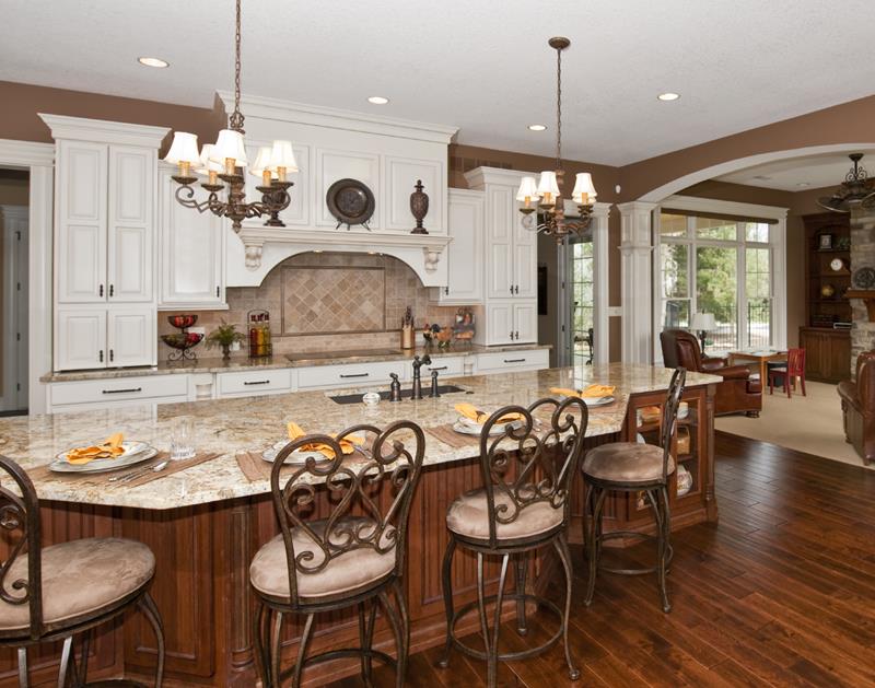 Luxury kitchen with custom cabinetry and granite countertops.