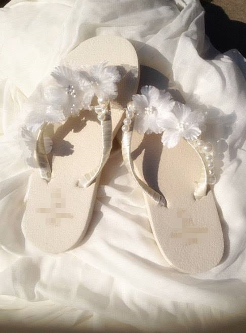 35 Stunning Beach Wedding Shoes for the Perfect Seaside Nuptials 35 White Wedge Bridal Flip Flops Sandals with flowers and pearls