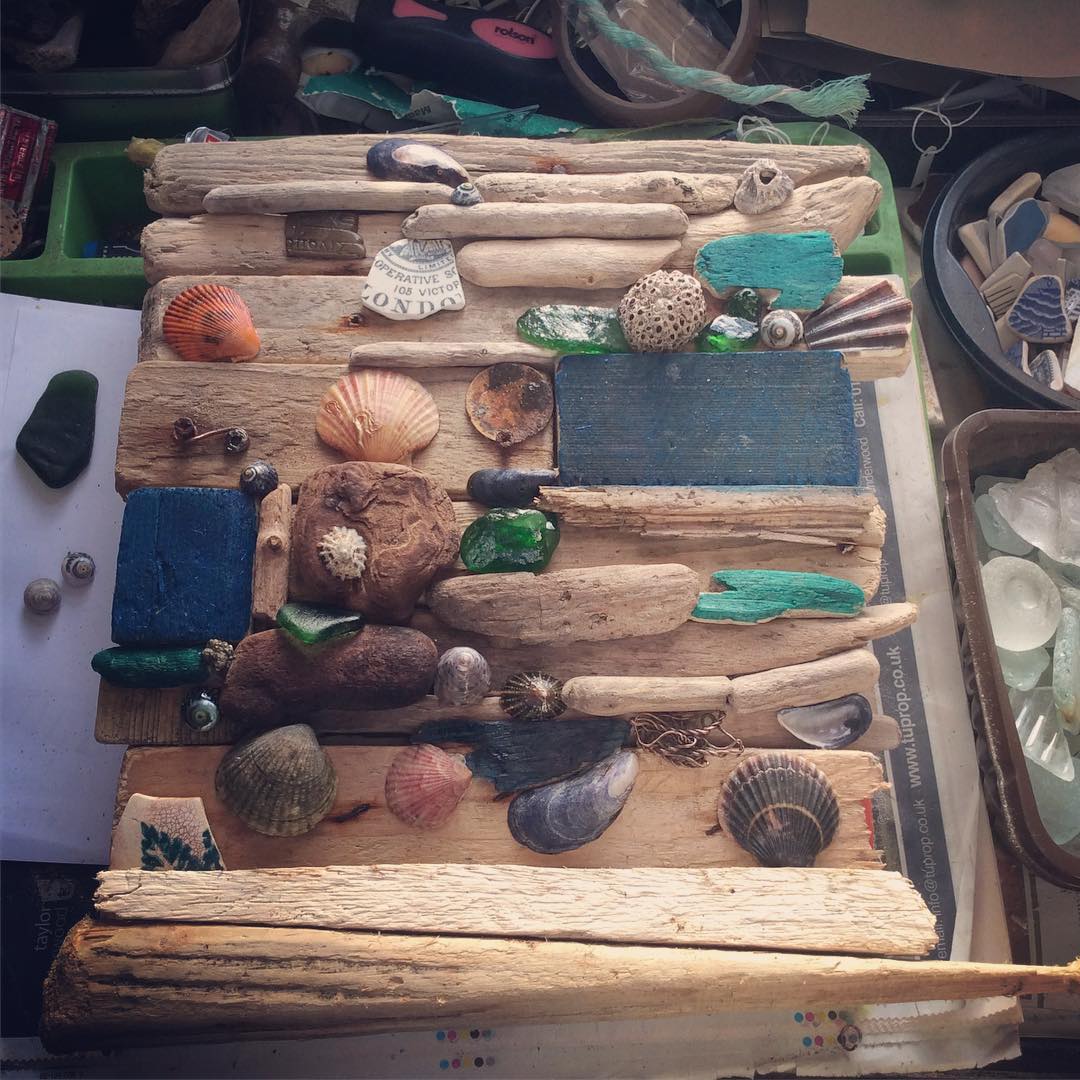 Adding the bits and bobs.#driftwoodart #beachcraft #seaglass