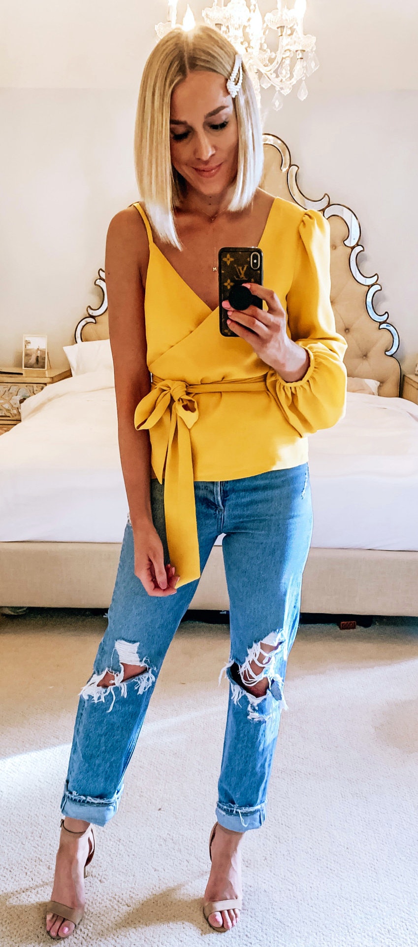 Brown high heels, distressed blue denim and yellow one-shoulder shirt.
