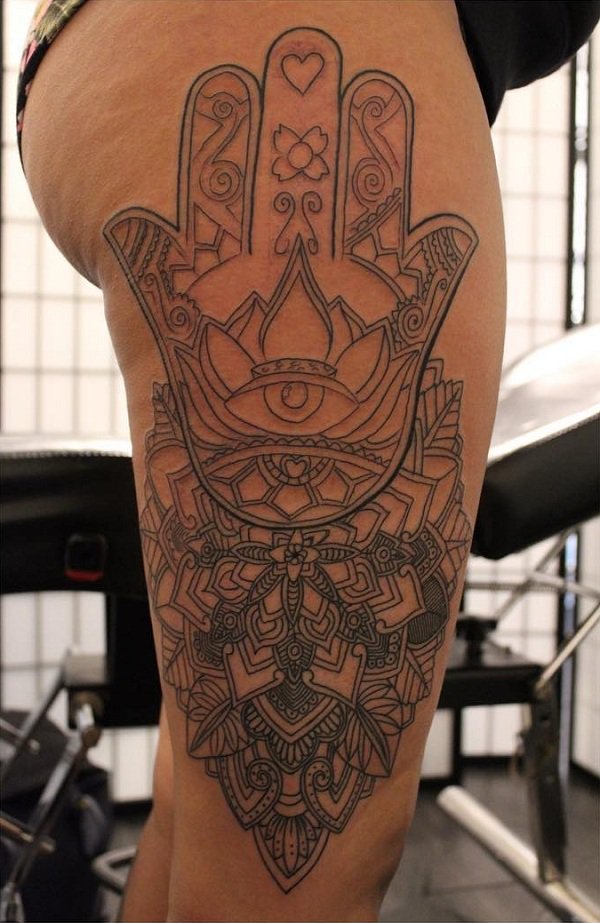 Large hamsa tattoo done on the thigh.