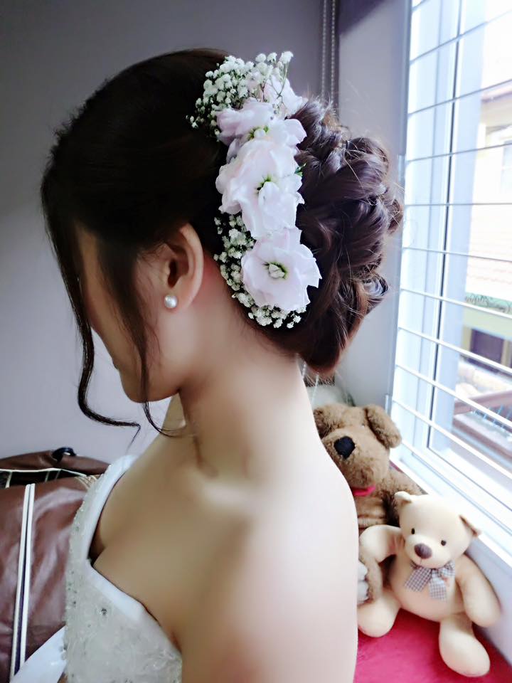 Curls Low Bun With Fresh Flowers