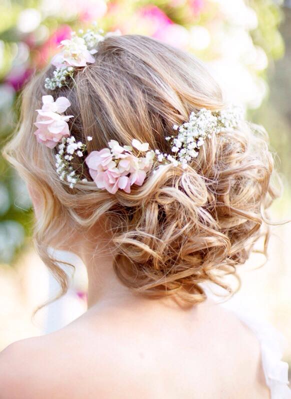 Messy Bun Decorated With Pink Flowers