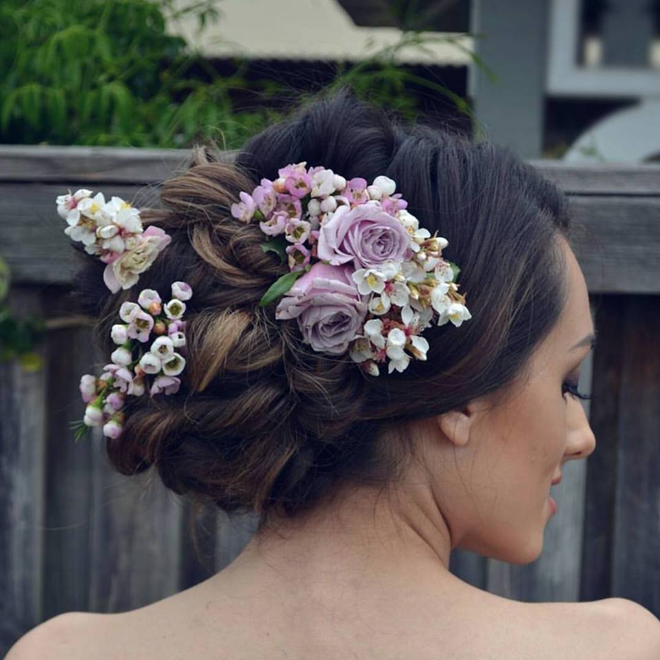 Soft Curls Bun With Flowers