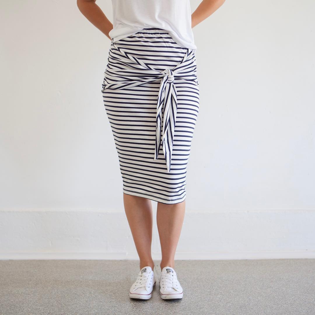We LOVE our stripe tie-front skirt! It is oh so comfy! Simply add a tee and our Avery denim jacket, and off you go! #stripeskirt #tieskirt #comfort #midiskirt