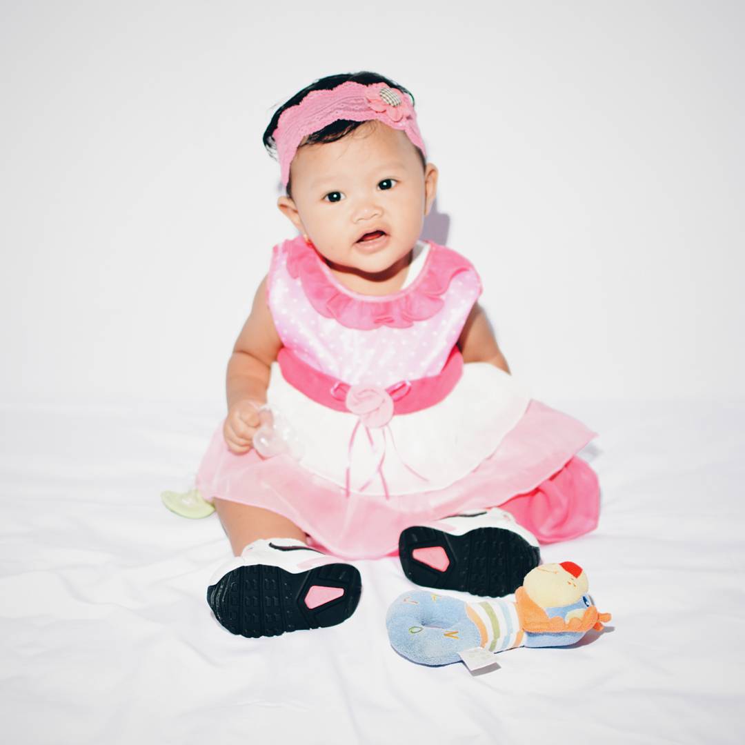 Baby Girl Wearing Pink Frock With Sneakers