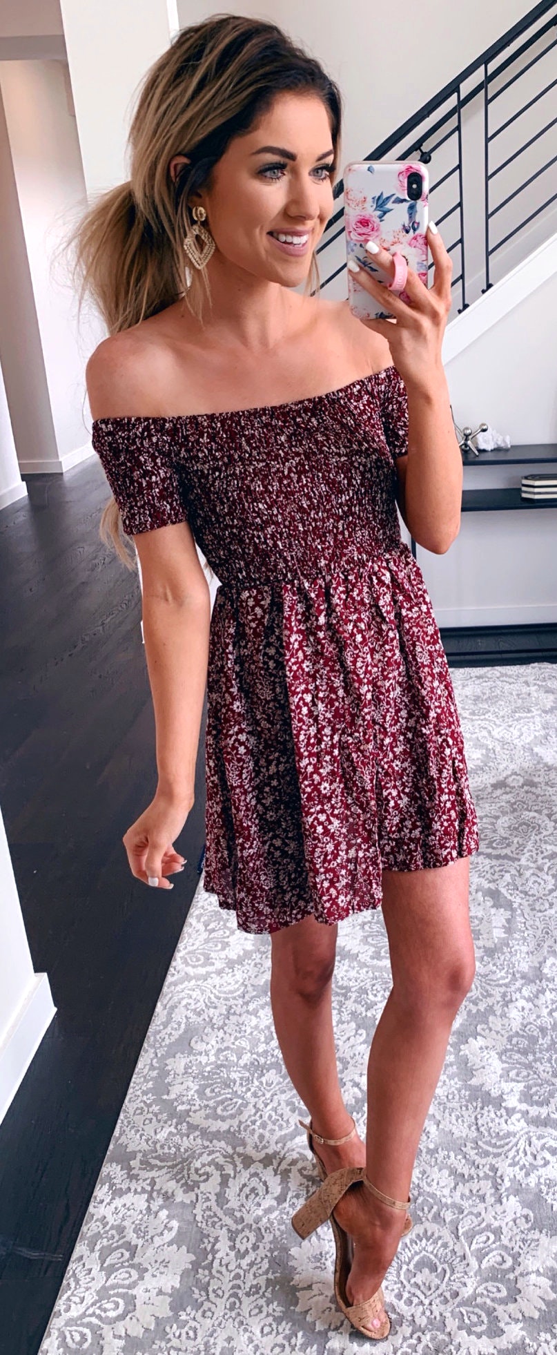 Brown and white floral off-shoulder mini dress.