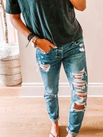 Cute distressed blue denim jeans and gray shirt.