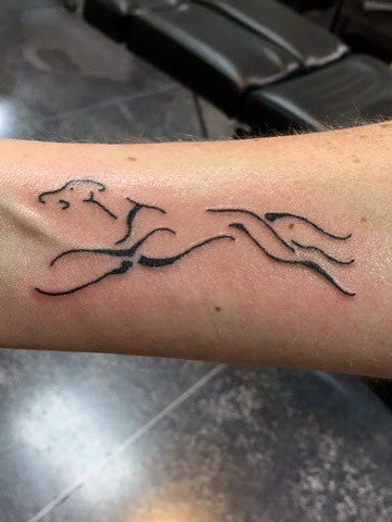 Negative Space Running Greyhound Dog Tattoo On Wrist