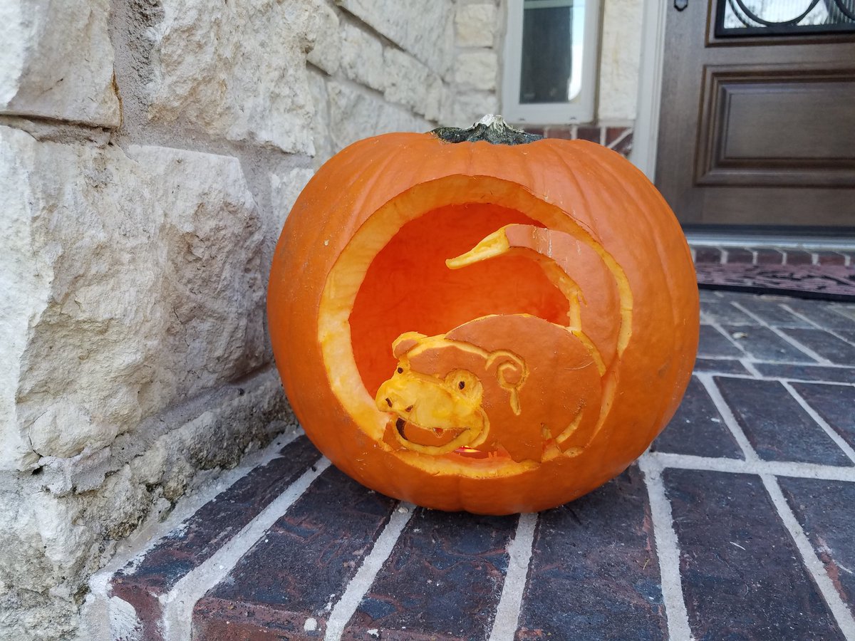 Carving a pumpkin, just in time for Halloween.