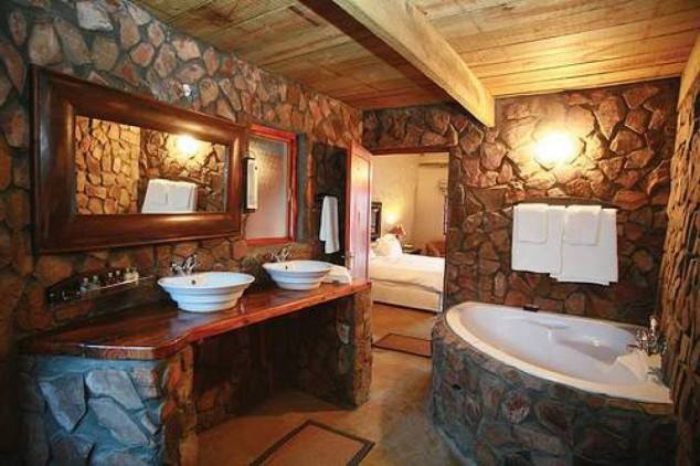 Eye Catching Natural Stone Made Bathroom With Wooden Frame Mirror, Counter & Roof