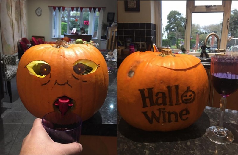 Halloween decoration with a pumpkin and a bag of wine.