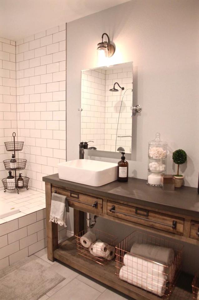 Impressive Rustic Bathroom With White Subway Tiles, Frameleass Mirror & Wooden Desk