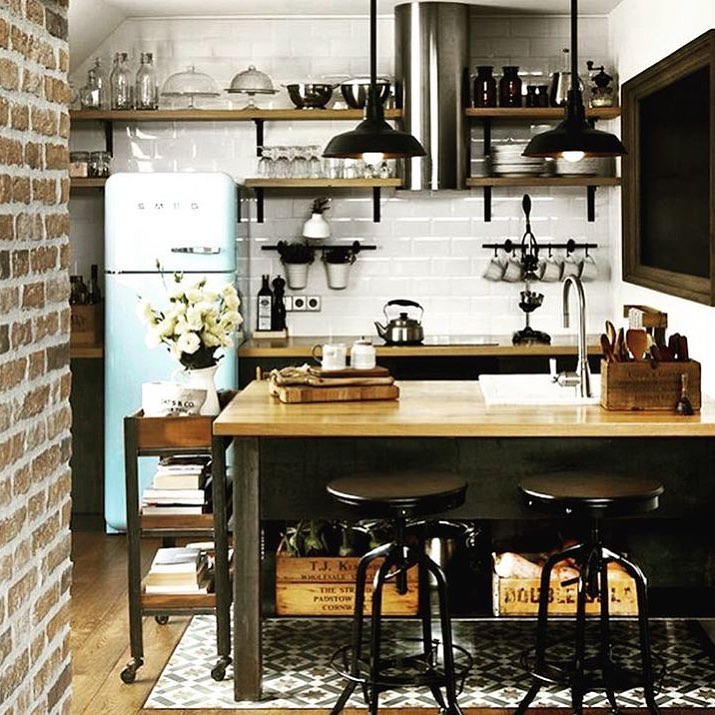 Insustrial Style Kitchen With Curved Fridge & Brick Wall