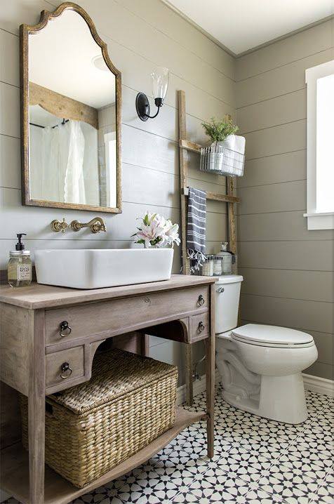 Old Dresser Is Used As Desk In Bathroom, Ladder As Storage & Wooden Frame Mirror