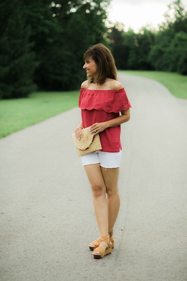 Red Off The Shoulder Top, White Shorts With Pom Pom Clutch & Kensie Wedge