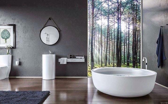 Round Bath, Round Mirror, Freestanding Basin & Warm Timber Floors Perfect For Contemporary Bathroom