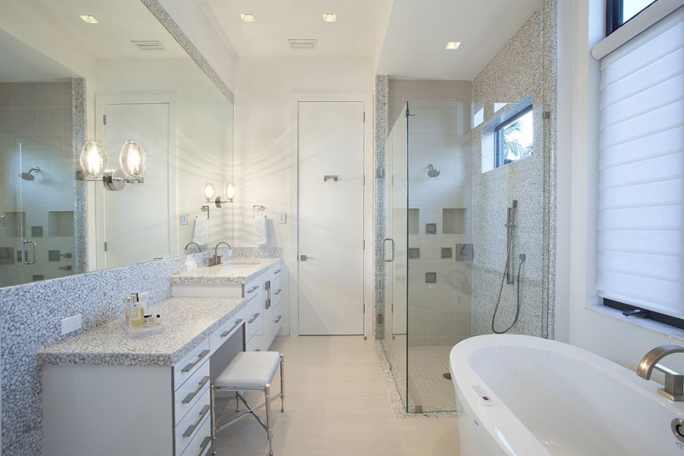 Stainless Steel Drawer Pulls, Pebble Backspash And Big Mirror Good For Contemporary Bathroom