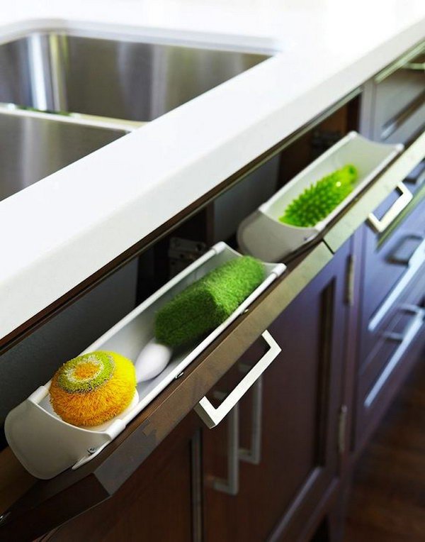 USE HIDDEN PULL OUT PANEL BELOW KITCHEN SINK TO STORE SPONGES AND ACCESSORIES