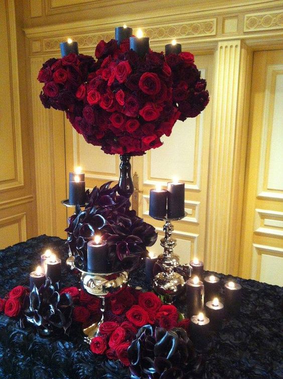 A tablescape like this one with red and black flowers by Jeff Leatham would be perfect for a nontraditional bride