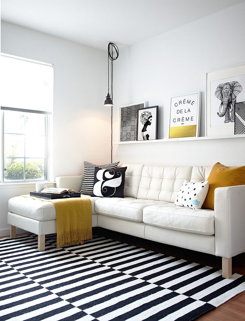 Black and white living room with elegant pops of yellow Design - Studio Revolution