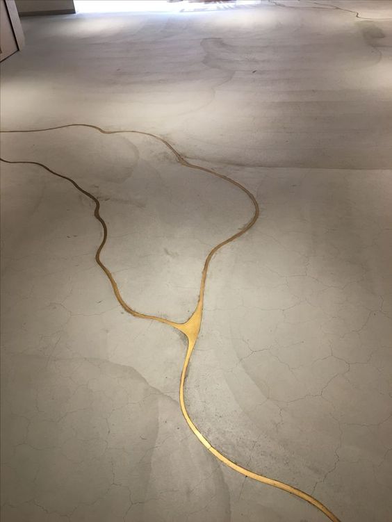 If our concrete floor cracks, we're doing this to it! It's concrete with liquid gold to fill the cracks!