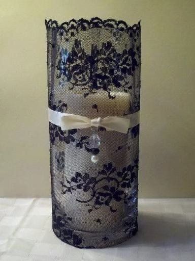 Lace wrapped candle holder.