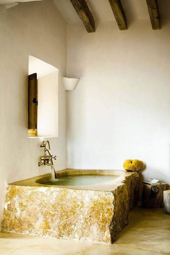 Stone Bathtub In Bohemian Bathroom