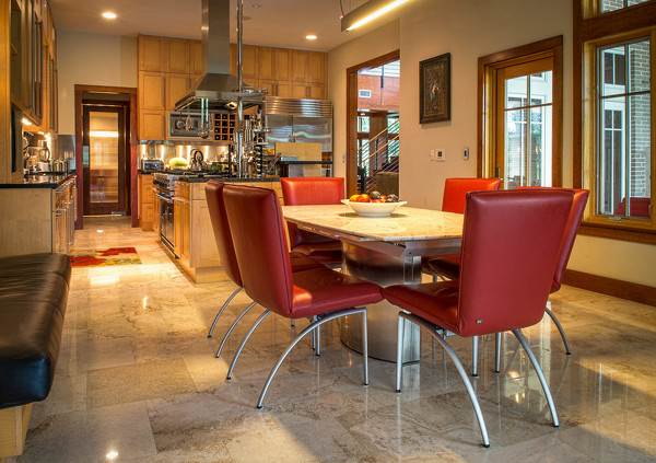 The soft sepia tones of this travertine tile add warmth to this kitchen design.