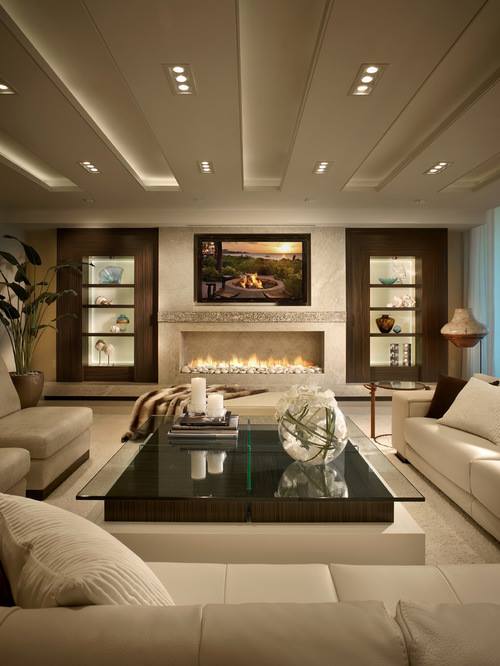 Amazing Living Room In Beige With Beautiful Wall Decor, Fire Pit & Glass Top Table