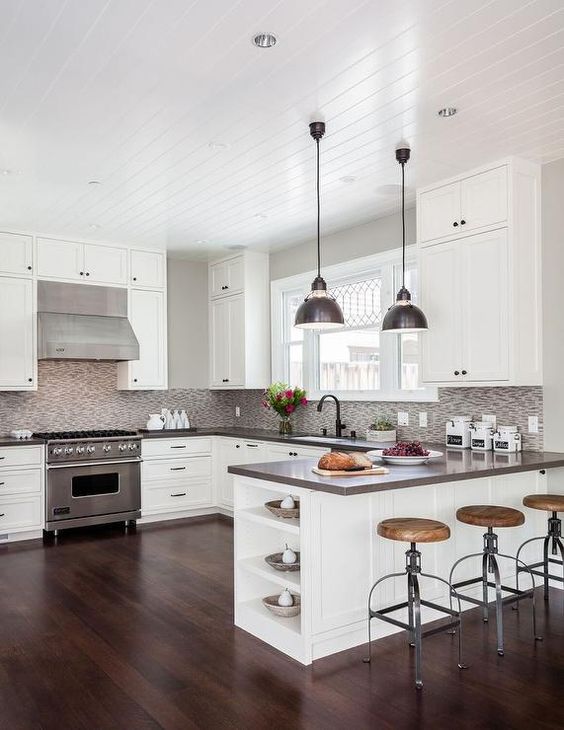 Contemporary kitchen features a beadboard ceiling over a white shaker