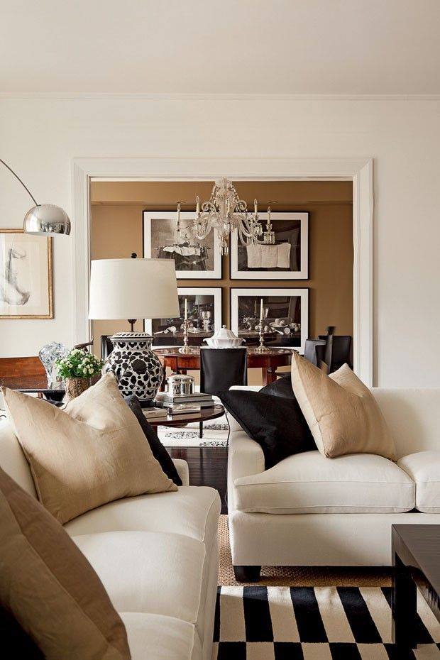 Small Beige Living Room With Chandelier