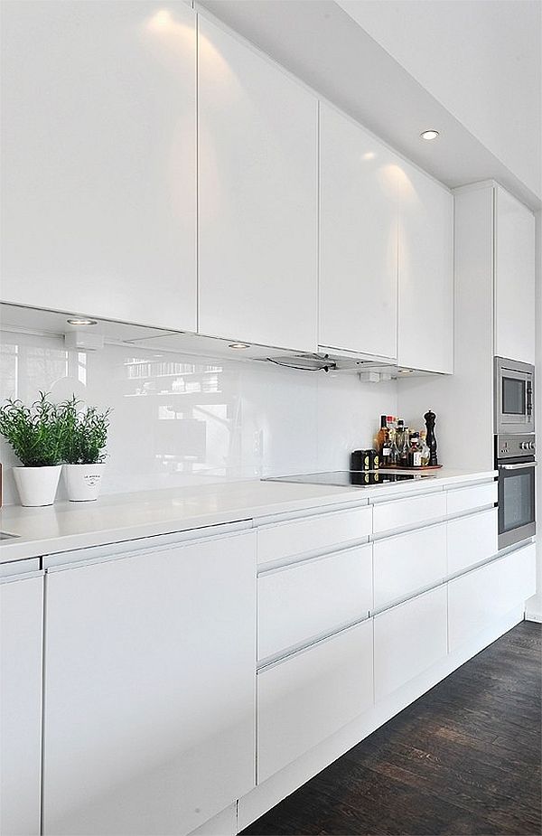 Contemporary white kitchens work best with clean and uncluttered lines.