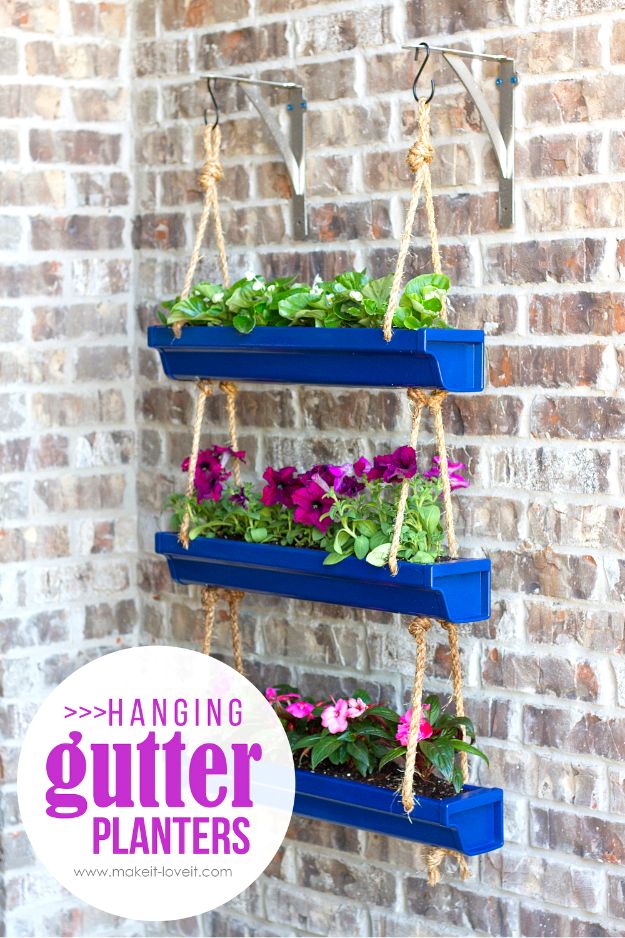 DIY Hanging Rain Gutter Planters via makeit-loveit