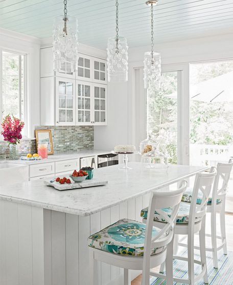 Glass walls will open up your kitchen and bring in all the colour and beauty of the outdoors.