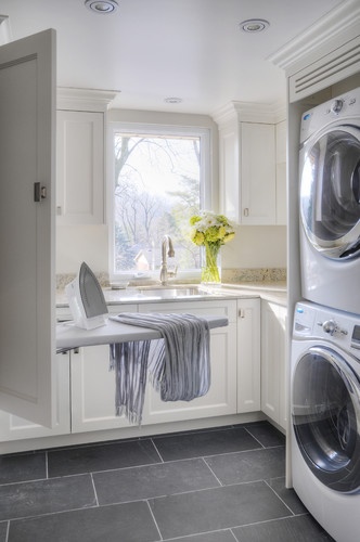 Grey slate floors are ideal for white laundry rooms.