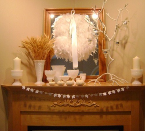 Hanging a wreath on a mirror is a quite interesting solution for fall mantel decor.