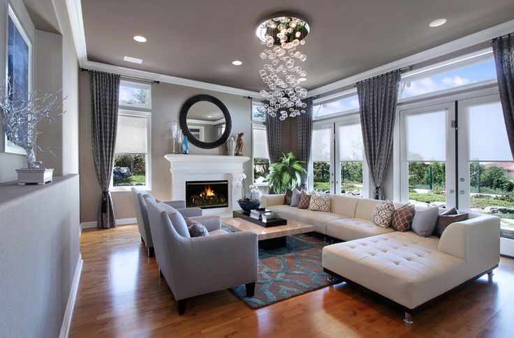Modern living rooms are made more spacious with larger, wider windows.