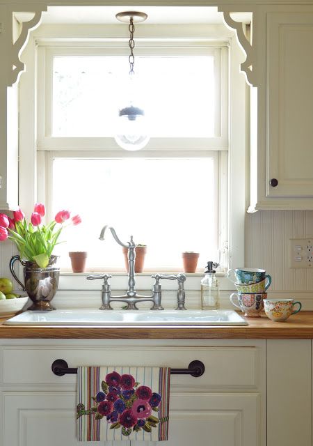 Relieve white kitchens with brightly coloured kitchen towels.