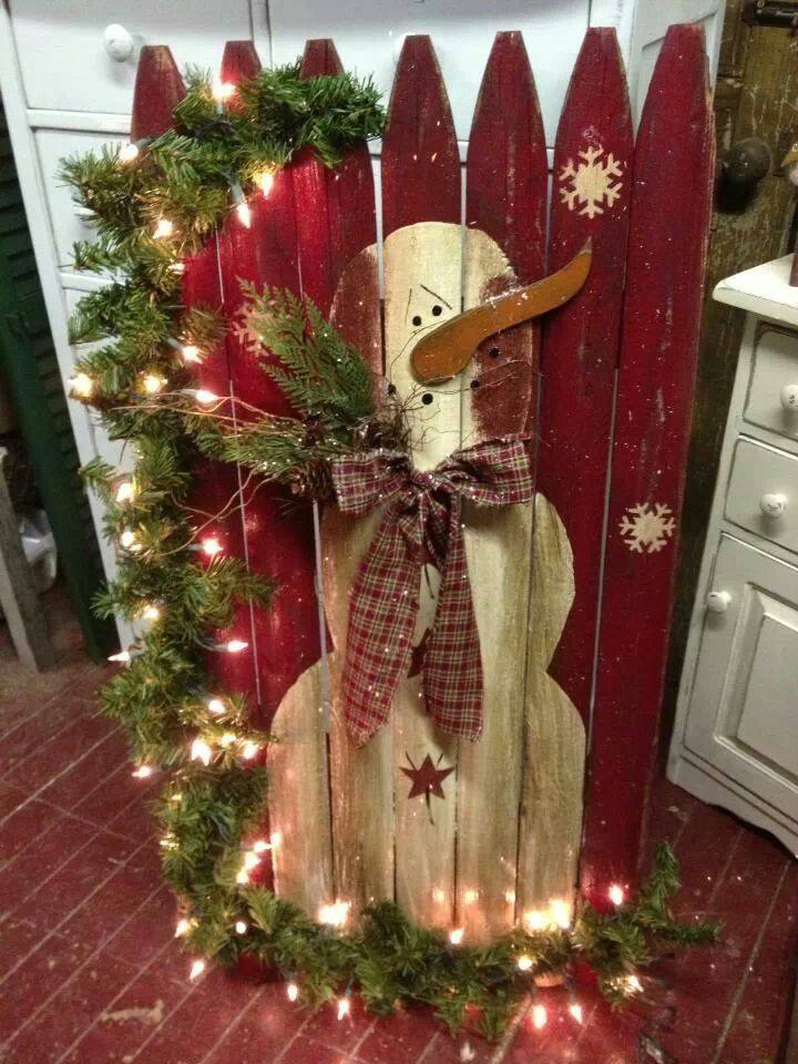Salvaged piece of Fence as a Canvas for Painting a Snowman