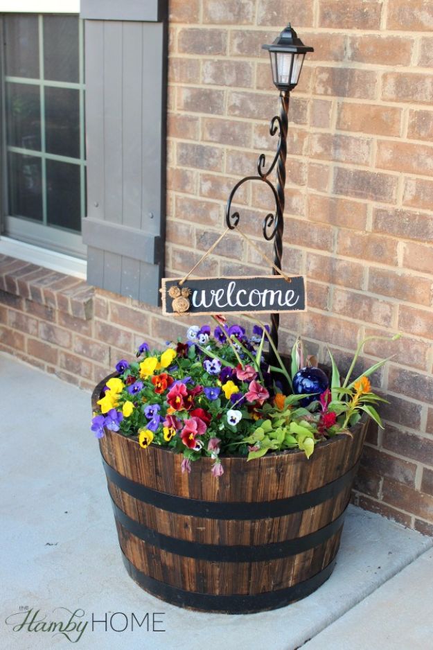 Whiskey Barrel Planter via thehambyhome