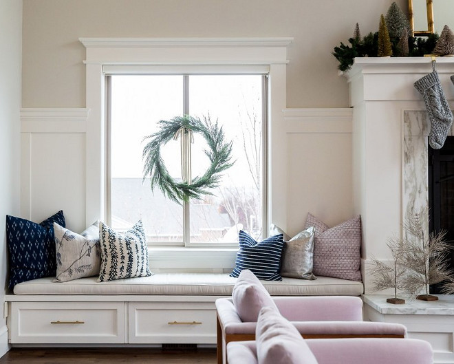 Window seat flanking fireplace.