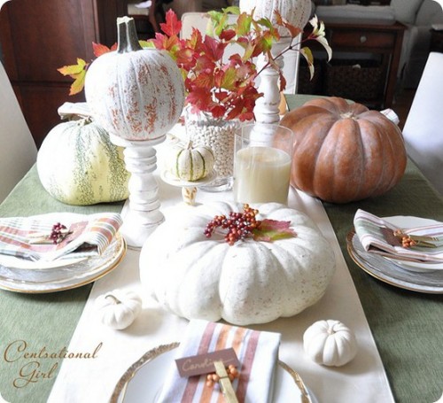 spray paint several pumpkins in white and use them as background for more traditional autumn's decorations