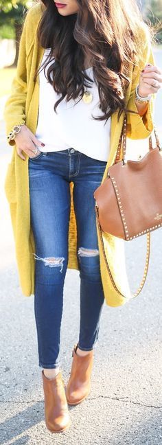white top + skinny jeans + boots + bag + card