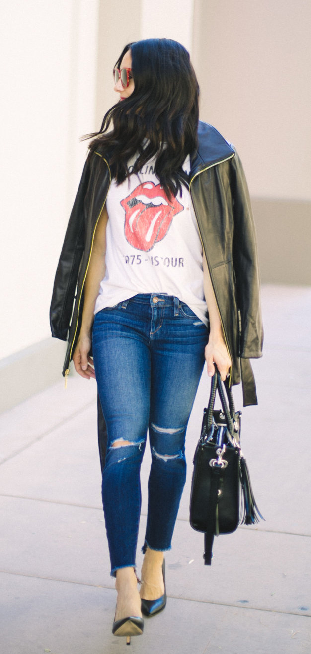 women's black leather zip-up jacket, white shirt, distressed denim fitted jeans, and blue leather pointed-toe pumps