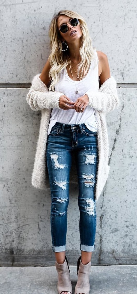 women's white tank top and distressed blue-washed jeans outfit