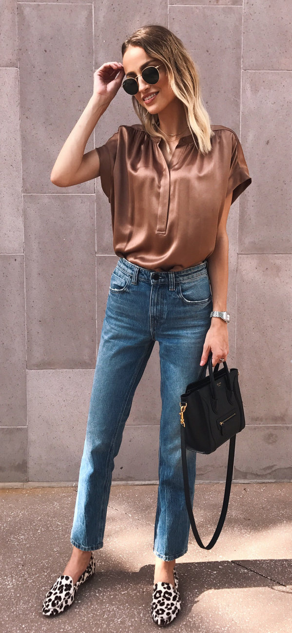 women's brown satin cap sleeve top, faded blue whiskered jeans, and leopard smoking loafers outfit