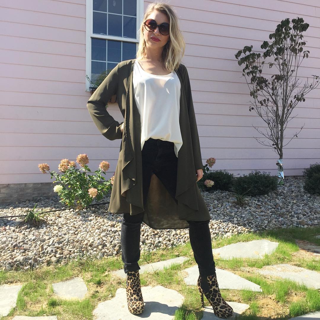Distressed black skinnies and an olive layer makes a chic outfit and quick