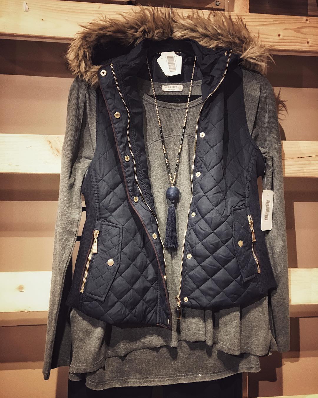 Lovin this hooded vest with faux fur lining