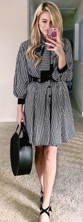 Black and white houndstooth long-sleeved dress holding black leather handbag. Fabulous Spring Outfits To Wear Now